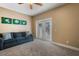 Relaxing bedroom with a comfy blue couch and access to the outdoors through glass doors at 6411 Grenada Island Ave, Apollo Beach, FL 33572