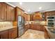 Spacious kitchen with stainless steel appliances, custom cabinets, tile backsplash, and granite countertops at 6411 Grenada Island Ave, Apollo Beach, FL 33572