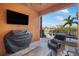 This outdoor living space has a flatscreen, outdoor furniture and a grill at 6411 Grenada Island Ave, Apollo Beach, FL 33572