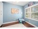 Charming ' playroom with a small table, chairs, wood floors, and ample natural light from the window at 6411 Grenada Island Ave, Apollo Beach, FL 33572