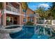 This home has an outdoor swimming pool, hot tub, and outdoor seating area at 6411 Grenada Island Ave, Apollo Beach, FL 33572