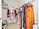 Walk-in closet providing ample storage with shelving and hanging space for clothes and shoes at 6980 Ulmerton Rd # 8C, Largo, FL 33771