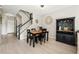 Bright dining area featuring stylish décor and a staircase at 6980 Ulmerton Rd # 8C, Largo, FL 33771