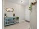 Charming entryway with wood-look floors and a decorative cabinet display at 6980 Ulmerton Rd # 8C, Largo, FL 33771