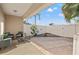 Private backyard patio area featuring a privacy fence and comfortable outdoor seating arrangement at 6980 Ulmerton Rd # 8C, Largo, FL 33771