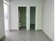 Bathroom with standing shower shown between two doorways at 8503 N Willow Ave, Tampa, FL 33604