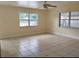 Bright bedroom with tile flooring and sunlit windows at 8503 N Willow Ave, Tampa, FL 33604
