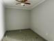 Bedroom with ceiling fan and neutral walls at 8503 N Willow Ave, Tampa, FL 33604