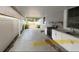 Outdoor kitchen area with cooking appliances and white cabinets at 8503 N Willow Ave, Tampa, FL 33604