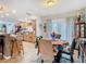 Inviting dining area next to a kitchen features tile floors, a round table, and bright natural light at 10608 Sassafras St, Tampa, FL 33617