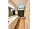 Well-lit bathroom featuring a vanity, linen closet, and shower/tub combination at 116 Silver Falls Dr, Apollo Beach, FL 33572