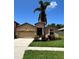 Charming single-story home with a two-car garage and beautifully landscaped front yard at 116 Silver Falls Dr, Apollo Beach, FL 33572