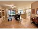 Open concept living room features tile flooring, modern furnishings and sliding glass doors for indoor/outdoor living at 116 Silver Falls Dr, Apollo Beach, FL 33572