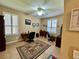 Functional home office offers natural light, tile flooring, and a comfortable workspace for productivity at 116 Silver Falls Dr, Apollo Beach, FL 33572