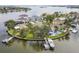 Aerial view of waterfront homes with lush landscaping, docks, and boat slips at 1514 Sea Gull S Dr, St Petersburg, FL 33707