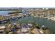 Waterfront homes along canal with boat docks and lush landscaping, boasting convenient water access at 1514 Sea Gull S Dr, St Petersburg, FL 33707