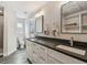 Bright bathroom features a double vanity and a walk-in shower at 1514 Sea Gull S Dr, St Petersburg, FL 33707