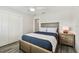 Bedroom featuring a ceiling fan and light gray wood-look floors at 1514 Sea Gull S Dr, St Petersburg, FL 33707
