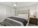 Bedroom featuring a tufted headboard and light gray wood-look floors at 1514 Sea Gull S Dr, St Petersburg, FL 33707
