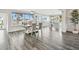 Bright dining area featuring tile floors and expansive windows overlooking a beautiful waterfront at 1514 Sea Gull S Dr, St Petersburg, FL 33707
