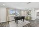 Game room features a foosball table next to a large window and decor shelving at 1514 Sea Gull S Dr, St Petersburg, FL 33707