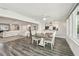 Spacious open living room and dining area with luxury vinyl plank flooring and natural light at 1514 Sea Gull S Dr, St Petersburg, FL 33707