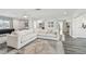 Open living room with large sectional sofa, stylish rug, and modern decor at 1514 Sea Gull S Dr, St Petersburg, FL 33707