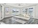 Bright open living room with sliding glass doors to the pool and waterfront at 1514 Sea Gull S Dr, St Petersburg, FL 33707