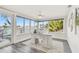 Bright office with a waterfront view, desk and chair, and large windows at 1514 Sea Gull S Dr, St Petersburg, FL 33707