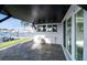 Covered patio with sliding glass doors looking out to the water at 1514 Sea Gull S Dr, St Petersburg, FL 33707