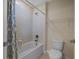 Cozy bathroom with tub and shower combination, toilet, and neutral design at 19429 Paddock View Dr, Tampa, FL 33647