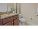 Well-maintained half bath with granite countertop, decorative mirror, and tile flooring at 19429 Paddock View Dr, Tampa, FL 33647