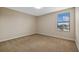 Cozy bedroom with neutral walls, carpet, base molding and a view of a lake at 19429 Paddock View Dr, Tampa, FL 33647