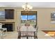 Bright dining area featuring a modern chandelier and sliding glass doors with a view at 19429 Paddock View Dr, Tampa, FL 33647