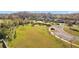 Expansive green space with homes, landscaping, and parking in the Heron Preserve community at 19429 Paddock View Dr, Tampa, FL 33647