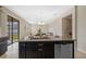 Spacious kitchen island with sink, granite countertops, and stainless steel dishwasher at 19429 Paddock View Dr, Tampa, FL 33647