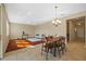Open-concept living and dining area with ample natural light and neutral color palette at 19429 Paddock View Dr, Tampa, FL 33647