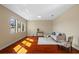 Sunlit living room with wood floors, bright windows, and stylish furniture at 19429 Paddock View Dr, Tampa, FL 33647