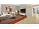 Cozy living room showcasing hardwood and tile floors, modern furniture and natural lighting at 19429 Paddock View Dr, Tampa, FL 33647