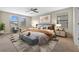 Comfortable main bedroom with large windows, stylish decor, and ample natural light at 19429 Paddock View Dr, Tampa, FL 33647