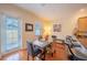 Dining space with a modern table, a kitchen bar, and a sliding glass door at 3410 Sondrio Cir, Tampa, FL 33611