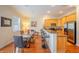Bright kitchen/dining area showcasing hardwood floors and modern decor at 3410 Sondrio Cir, Tampa, FL 33611
