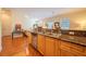 Kitchen area with granite countertops, wood cabinetry, and an open layout at 3410 Sondrio Cir, Tampa, FL 33611