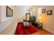 Inviting living room with a comfortable couch, a red rug, and stylish furnishings at 3410 Sondrio Cir, Tampa, FL 33611