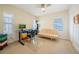 Bright office space with a ceiling fan, two large windows and neutral carpeting at 3410 Sondrio Cir, Tampa, FL 33611