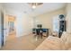 Bright office space features a ceiling fan, three windows, and neutral carpeting at 3410 Sondrio Cir, Tampa, FL 33611