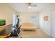 Bright office space features a ceiling fan, three windows, and neutral carpeting at 3410 Sondrio Cir, Tampa, FL 33611