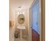 Charming powder room featuring pedestal sink and marble flooring at 3410 Sondrio Cir, Tampa, FL 33611