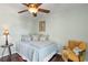 Cozy bedroom with hardwood floors, soft green walls, and comfortable furniture at 4810 W San Miguel St, Tampa, FL 33629