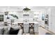 Bright kitchen features a large island with quartz countertops, stainless steel appliances, and designer backsplash at 4810 W San Miguel St, Tampa, FL 33629